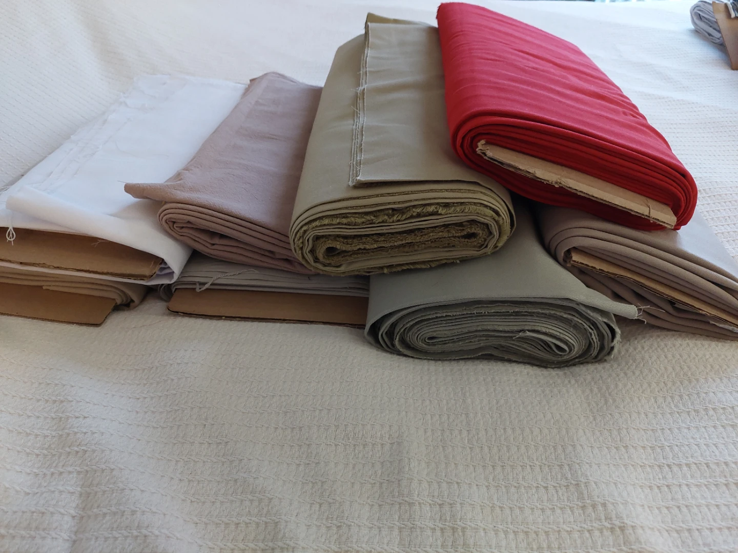 Rolls of assorted fabrics. - photo 4