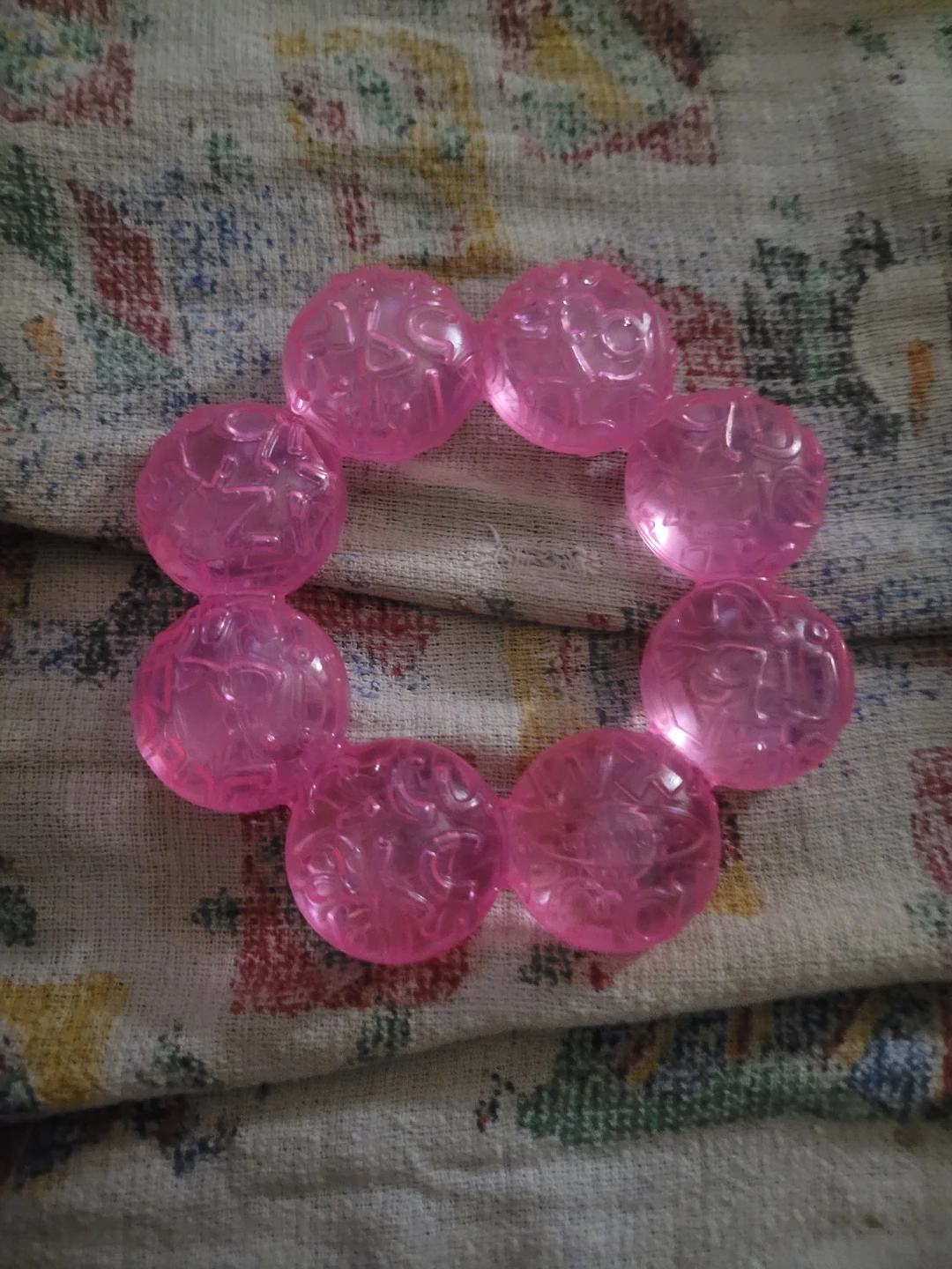 pink Infantino water teether.