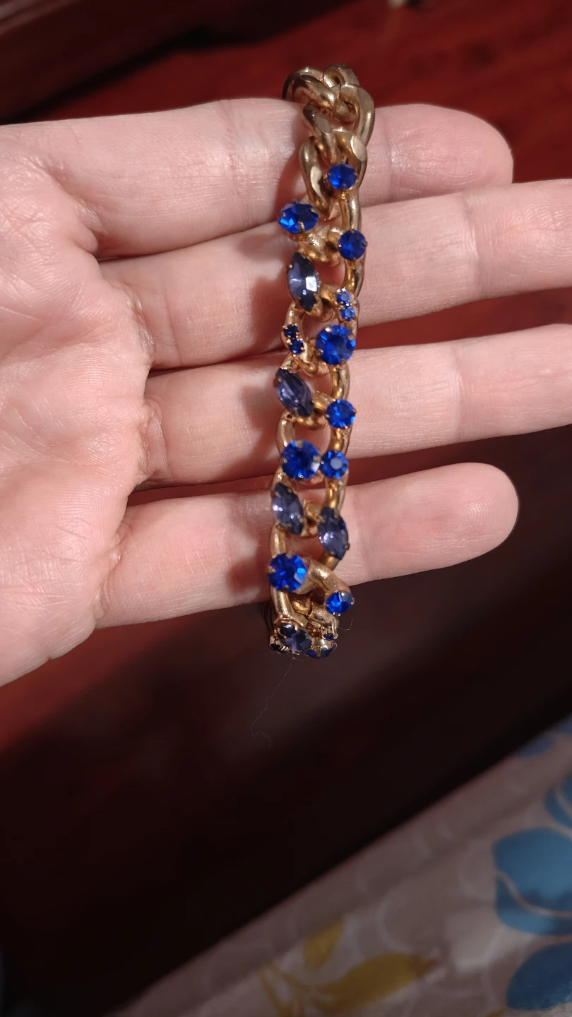 Gold-tone chain bracelet with blue rhinestones