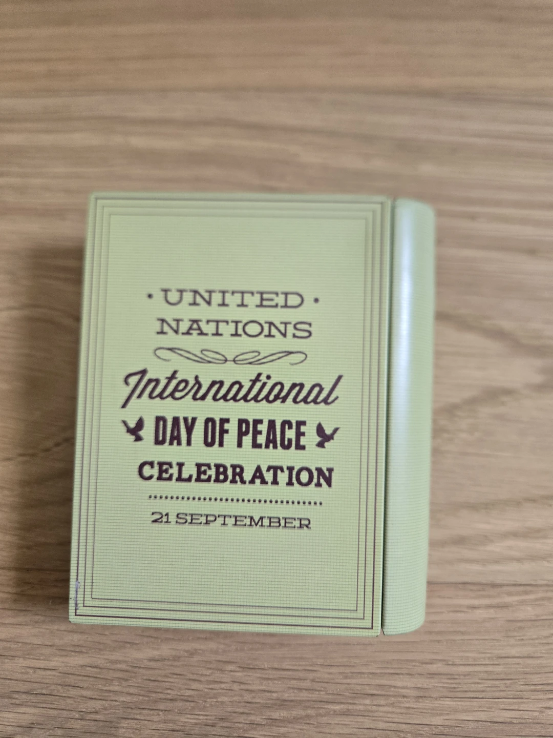 Mini Book Type Tin Storage Box Green International Day of Peace - photo 2
