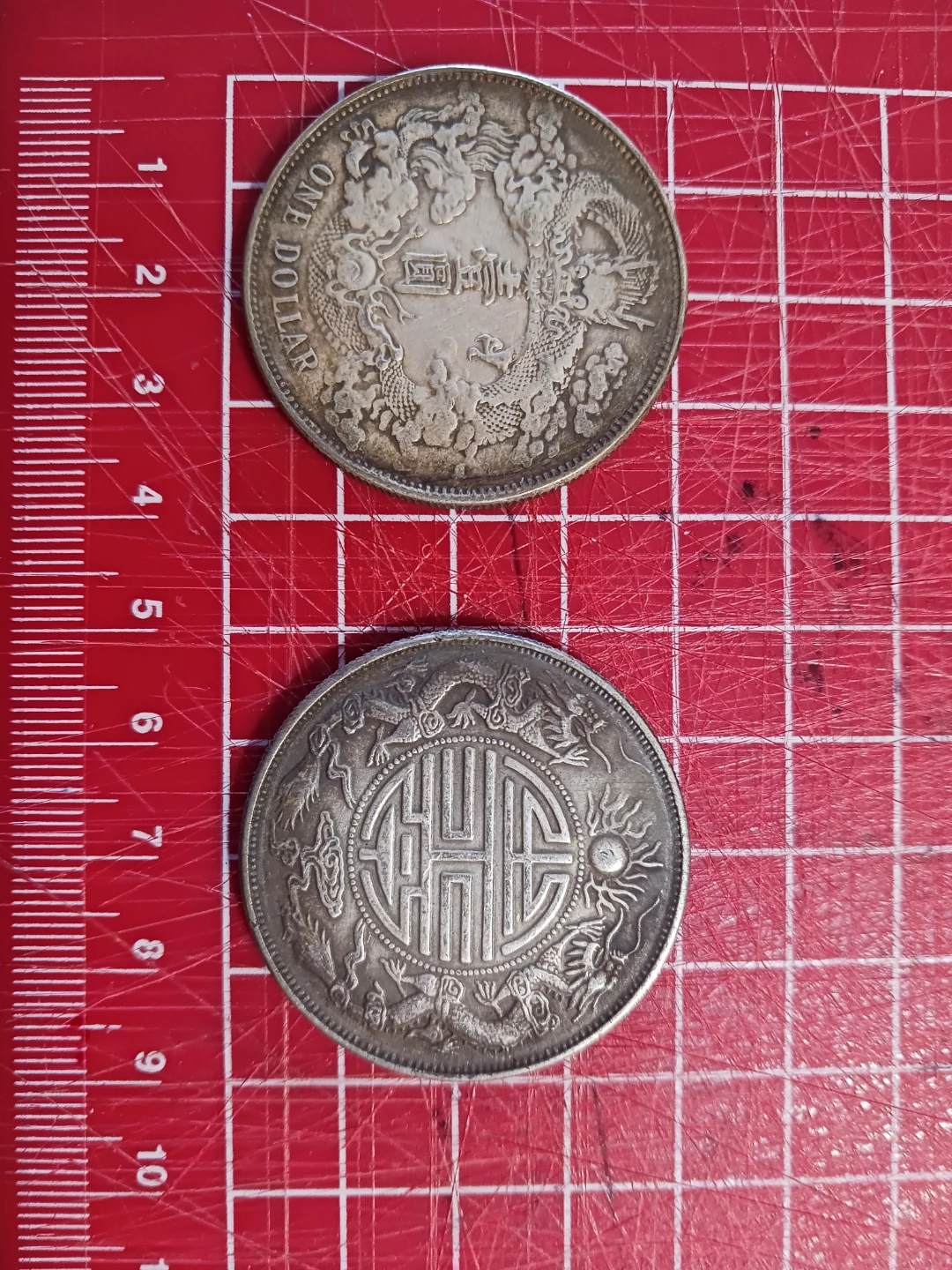 Two Antique Silver Dollar Coins