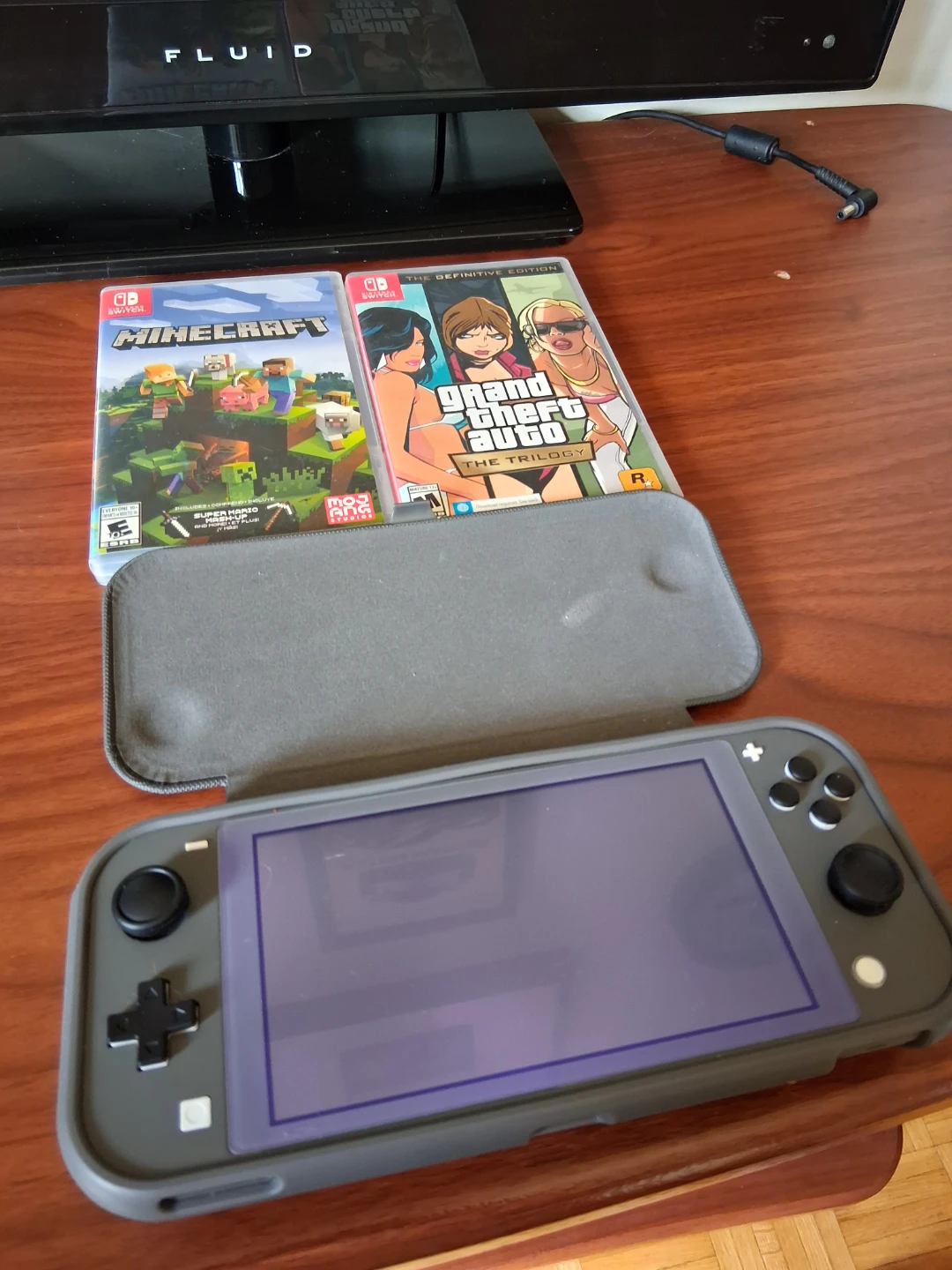 Nintendo Switch Lite with 2 Physical Games