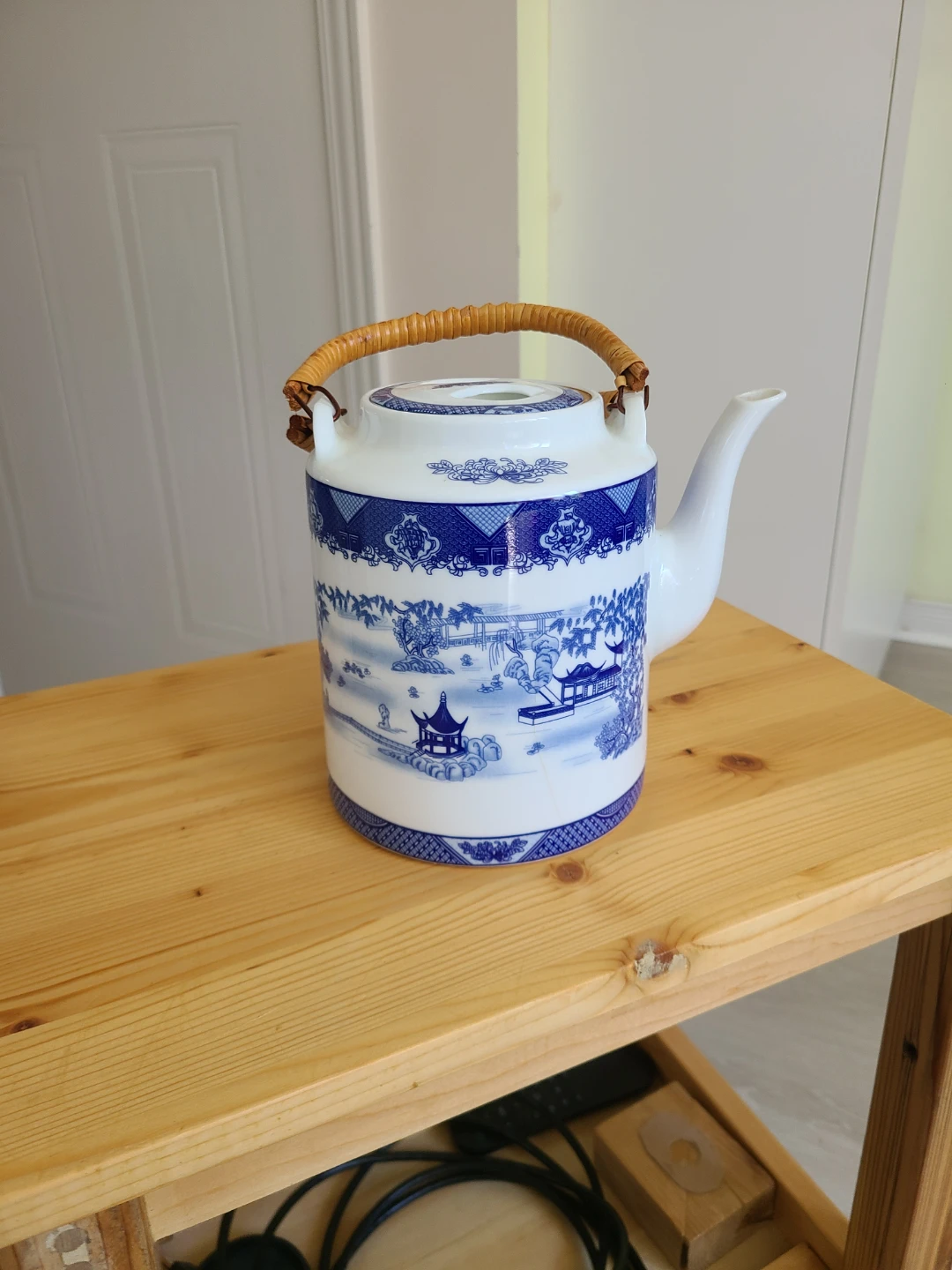 Blue and White Ceramic Teapot with Wicker Handle