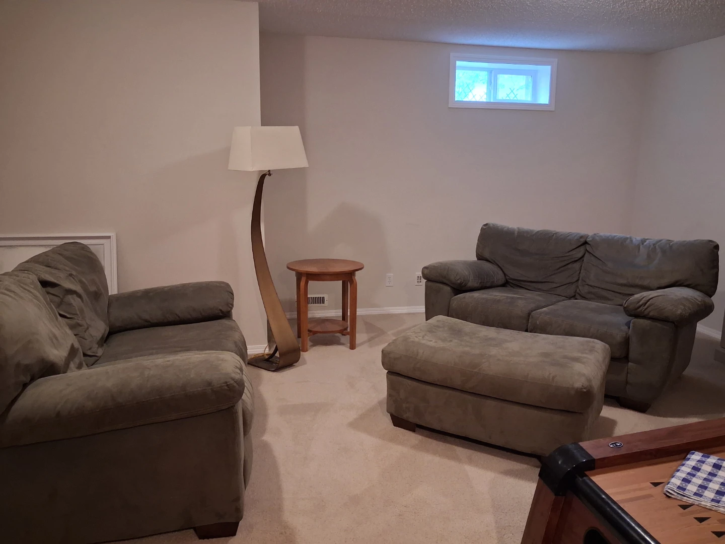 Green loveseat sofa with ottoman