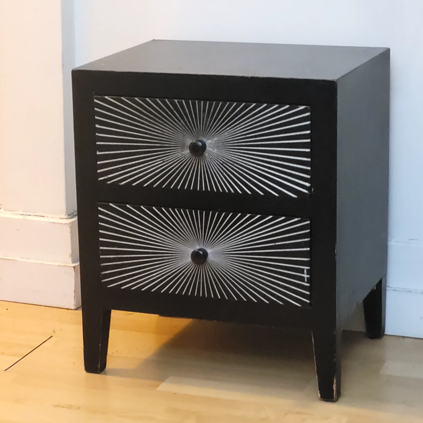 Black Two-Drawer Nightstand with Starburst Design