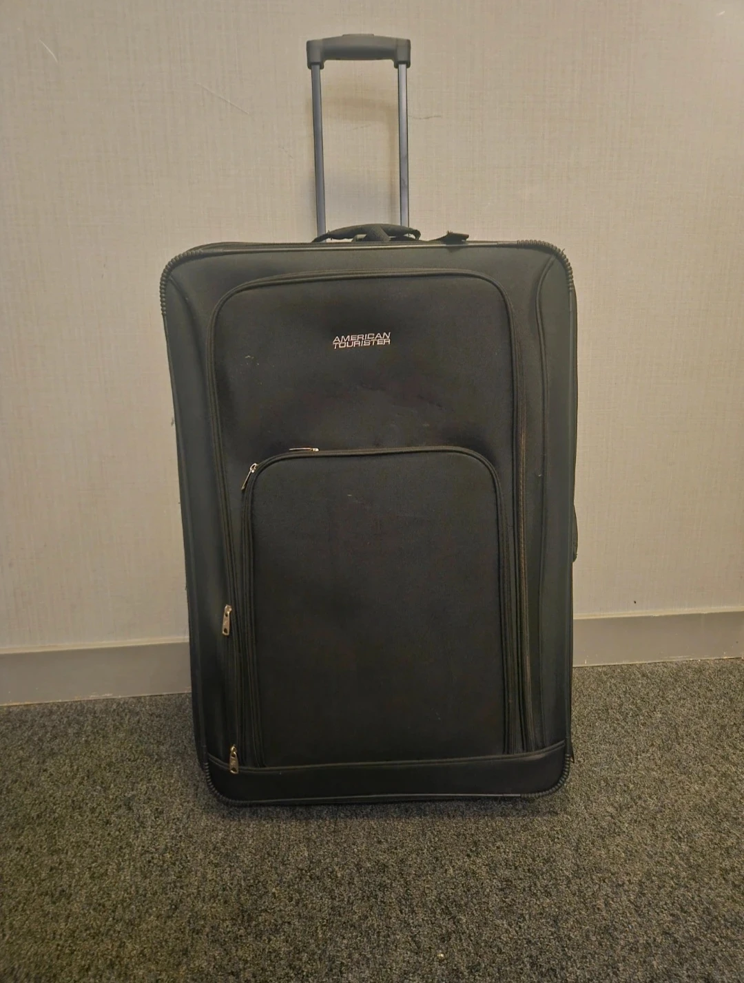 American Tourister Black Rolling Suitcase