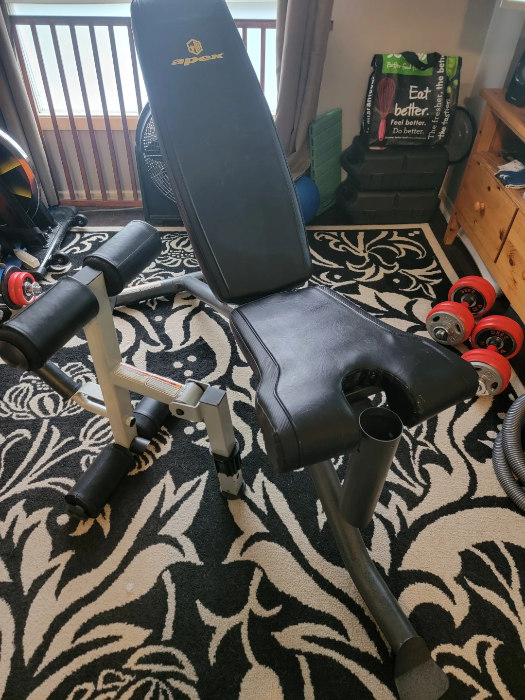 Exercise weightlifting bench with leg attachment