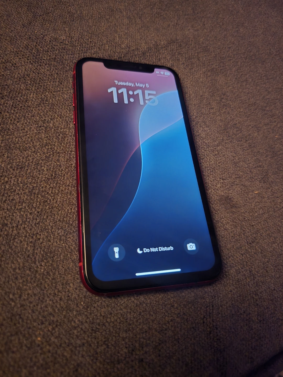 Red iPhone XR with cardholder case