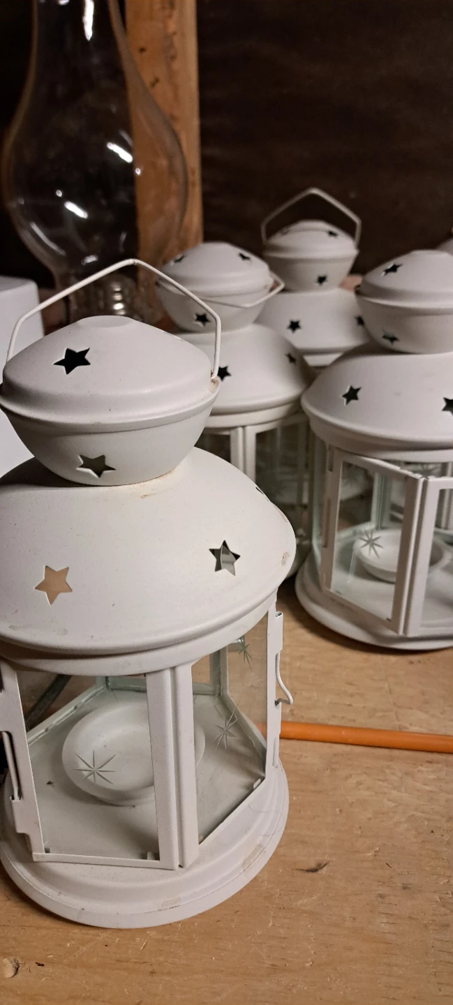 White metal lantern with star cutouts