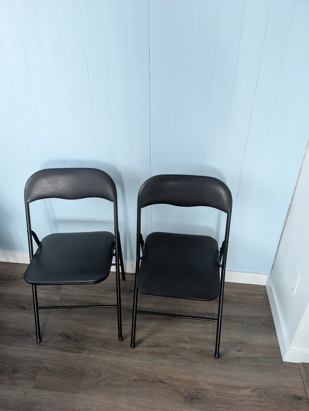 Three Black Folding Chairs