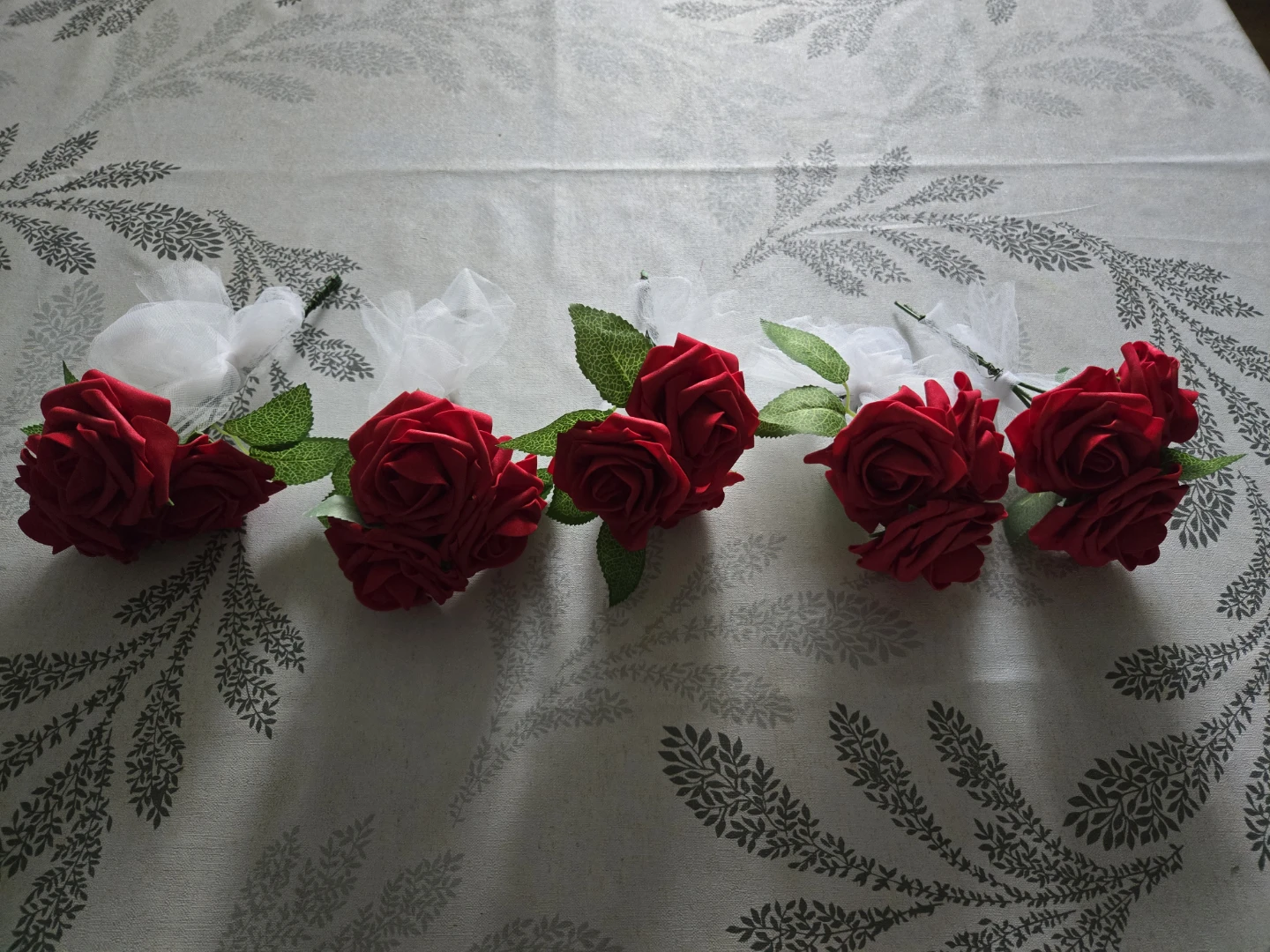 Red Faux Roses with White Tulle Boutonnieres