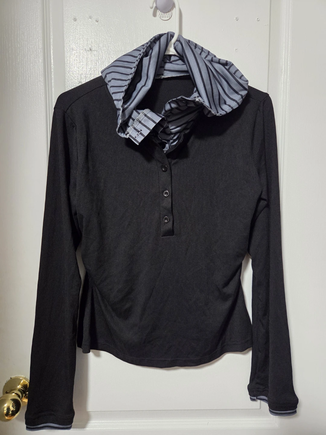 Black long-sleeve top with striped collar
