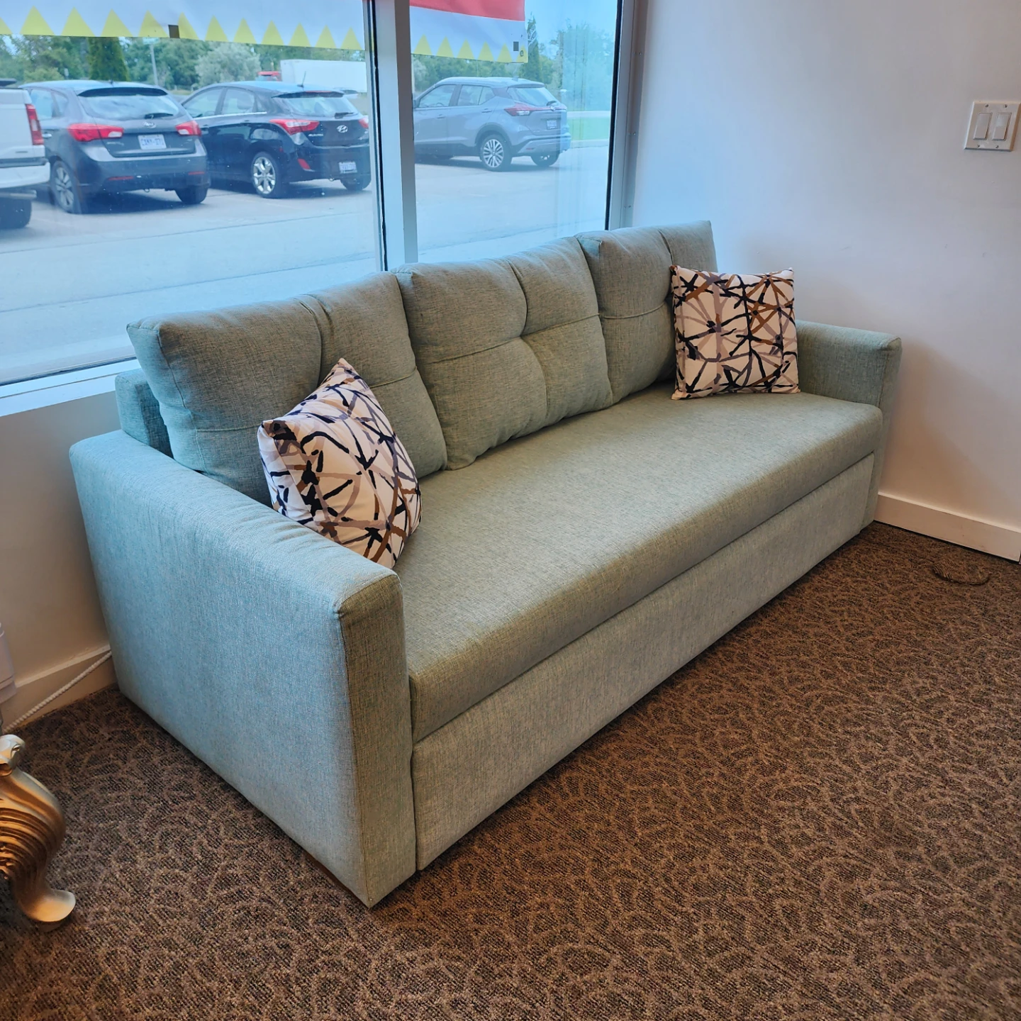 Light Blue Sofa Bed with Pillows