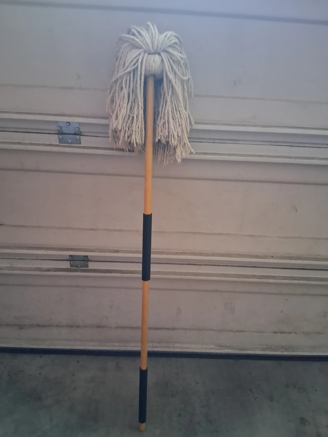 String mop with long wooden handle