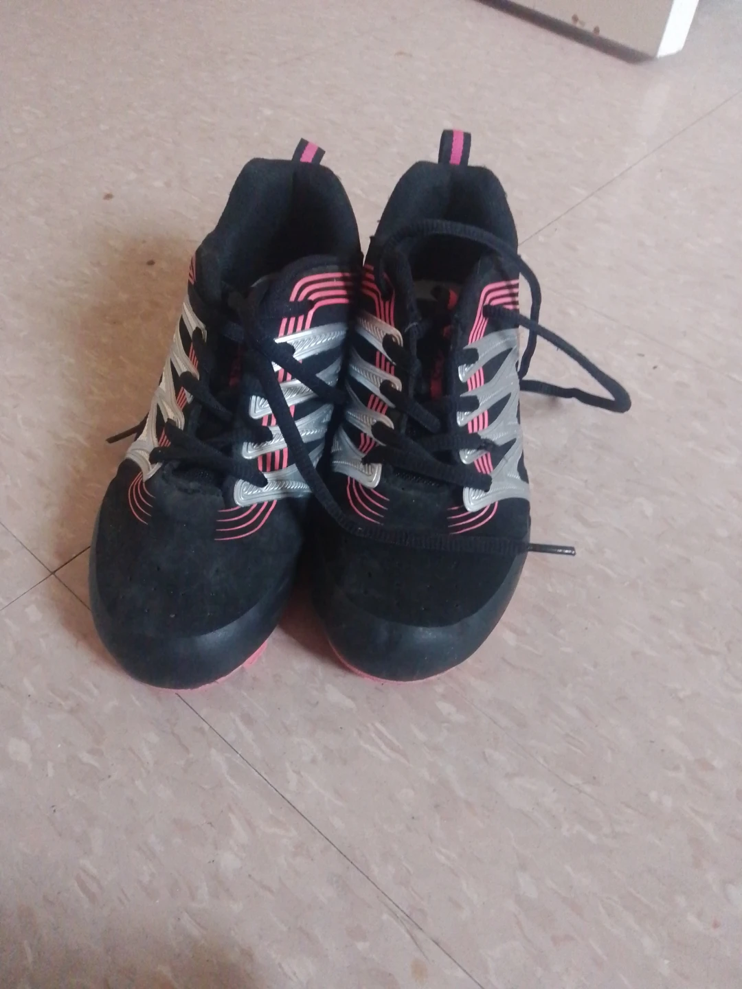 Black Adidas Cleats with Pink and Silver Accents
