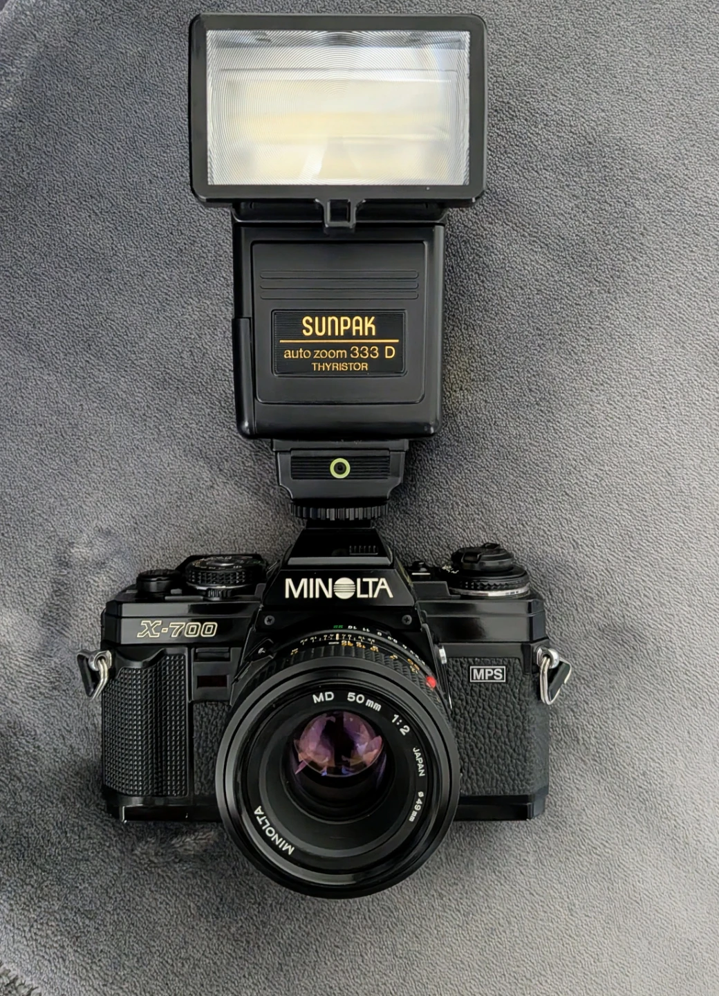 Minolta X-700 SLR Camera with Sunpak Flash and Tripod Head