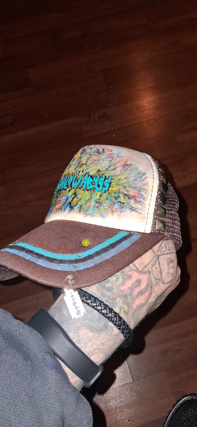 Custom hand painted and embellished hats.