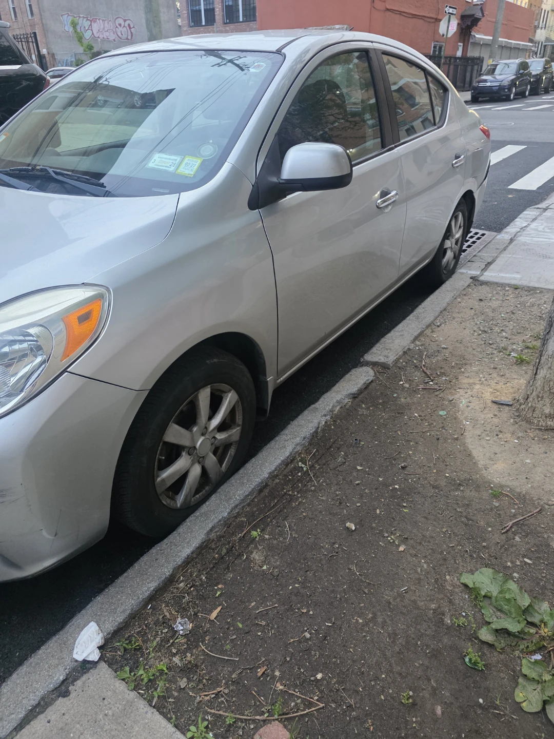 Silver Nissan Versa Sedan - photo 2
