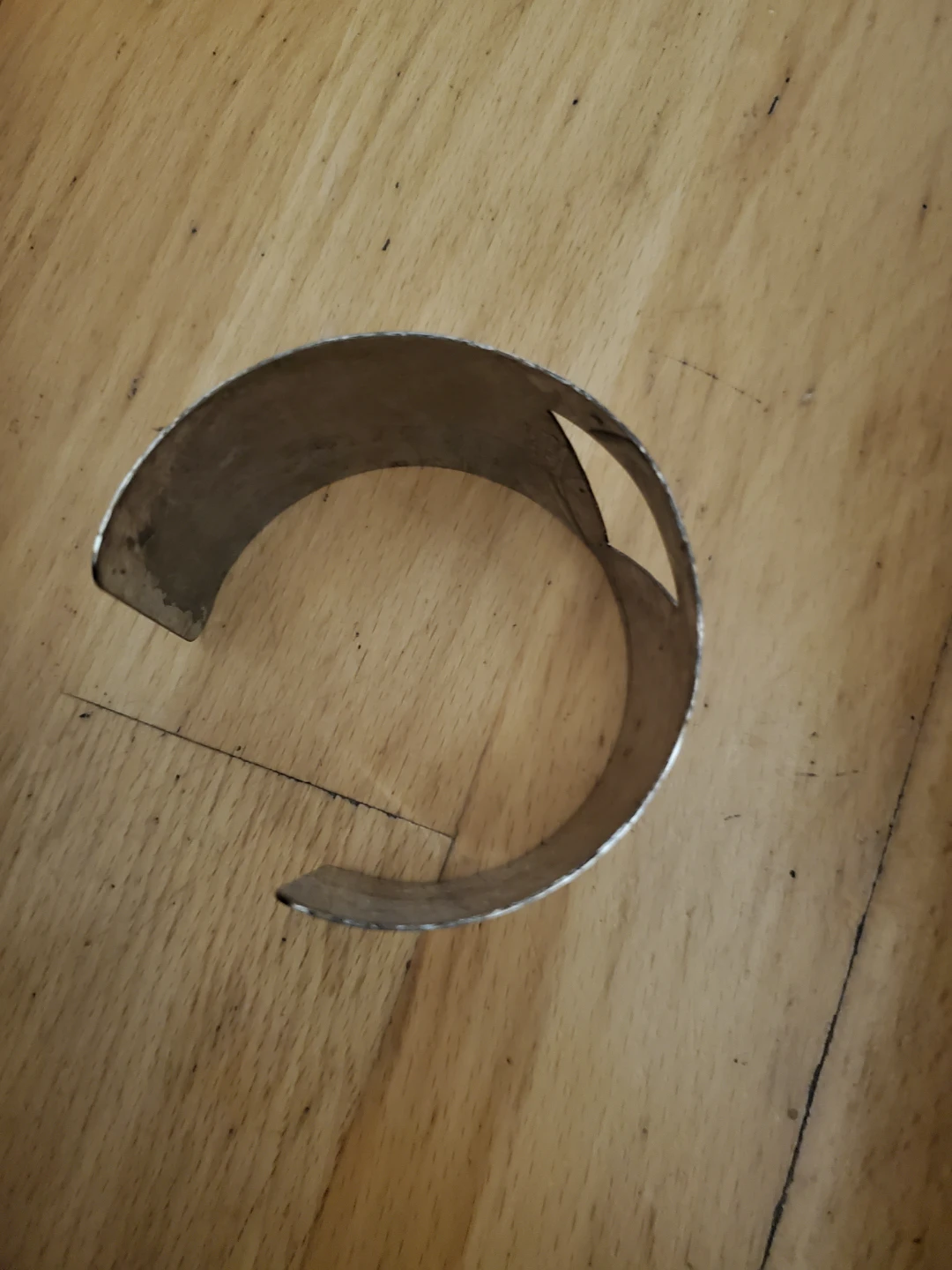Silver tone cuff bracelet with geometric cutout