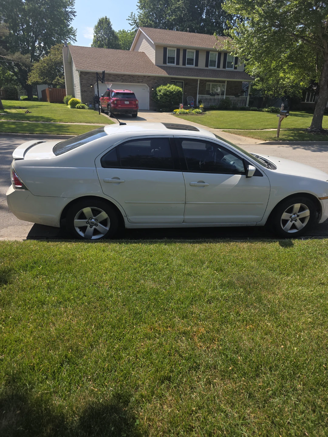 White Ford Fusion SE V6 Sedan