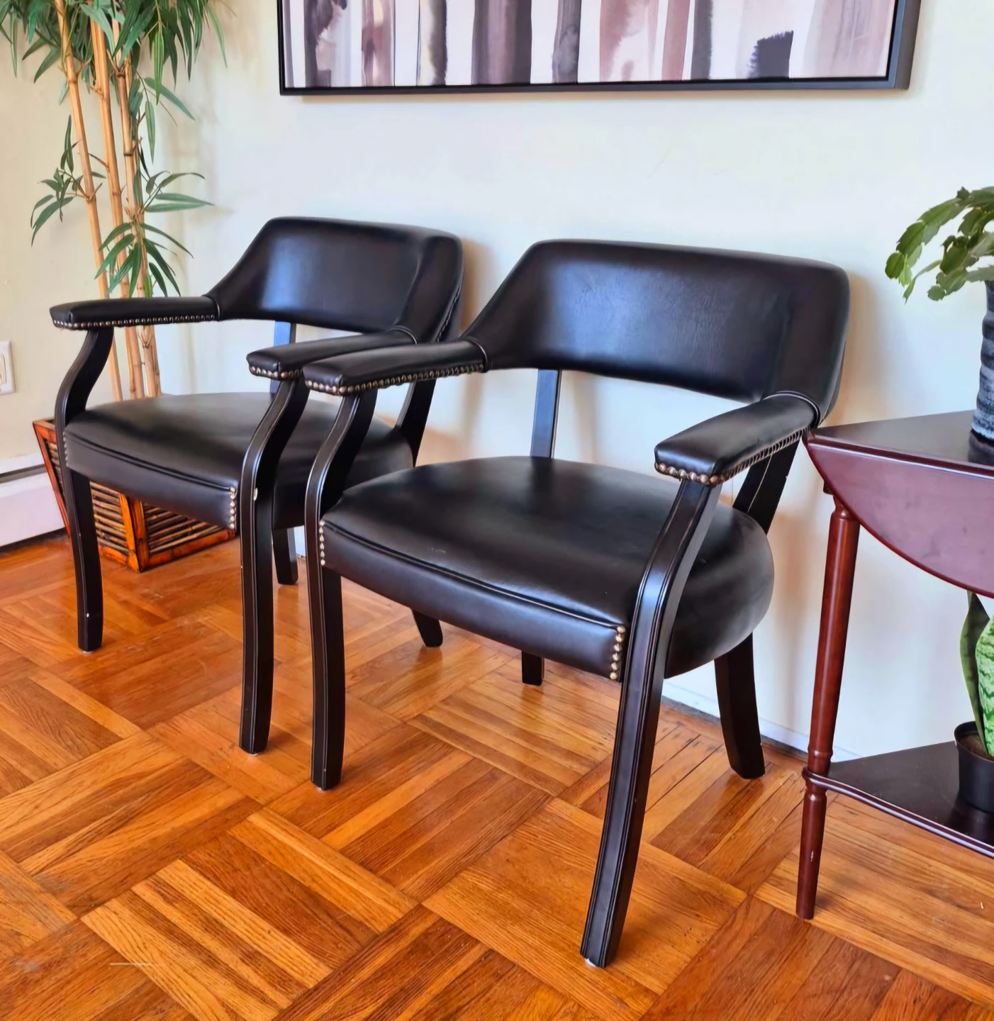 Pair Of Black Leather Horseshoe Accent Chairs