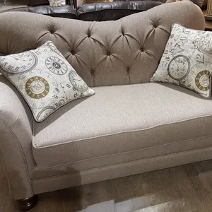 Tufted Loveseat with Clock Pillows