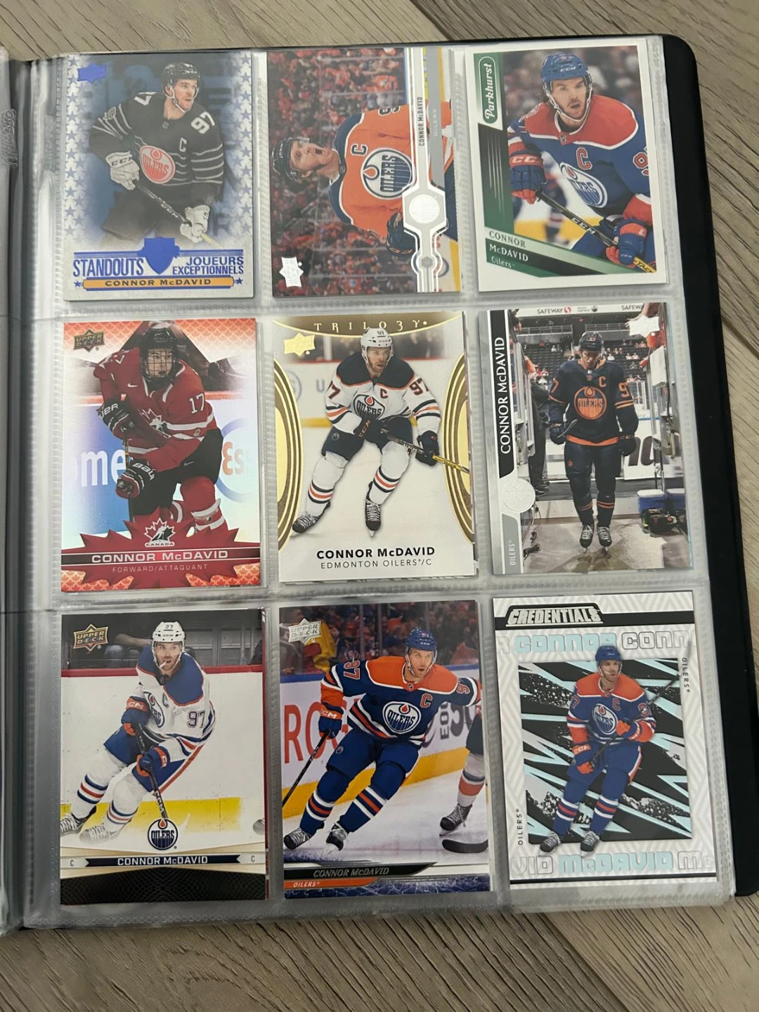 Connor McDavid hockey card collection in binder - photo 3