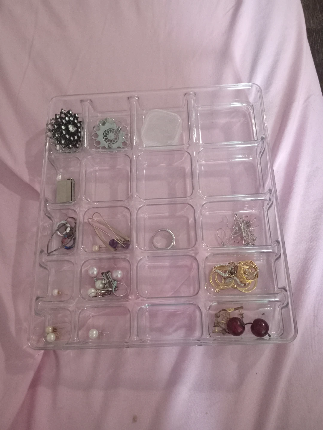 Clear plastic jewellery organizer with compartments