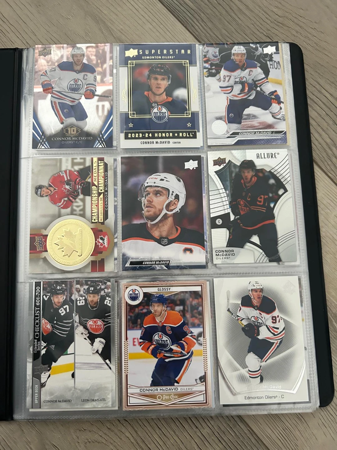 Connor McDavid hockey card collection in binder - photo 2