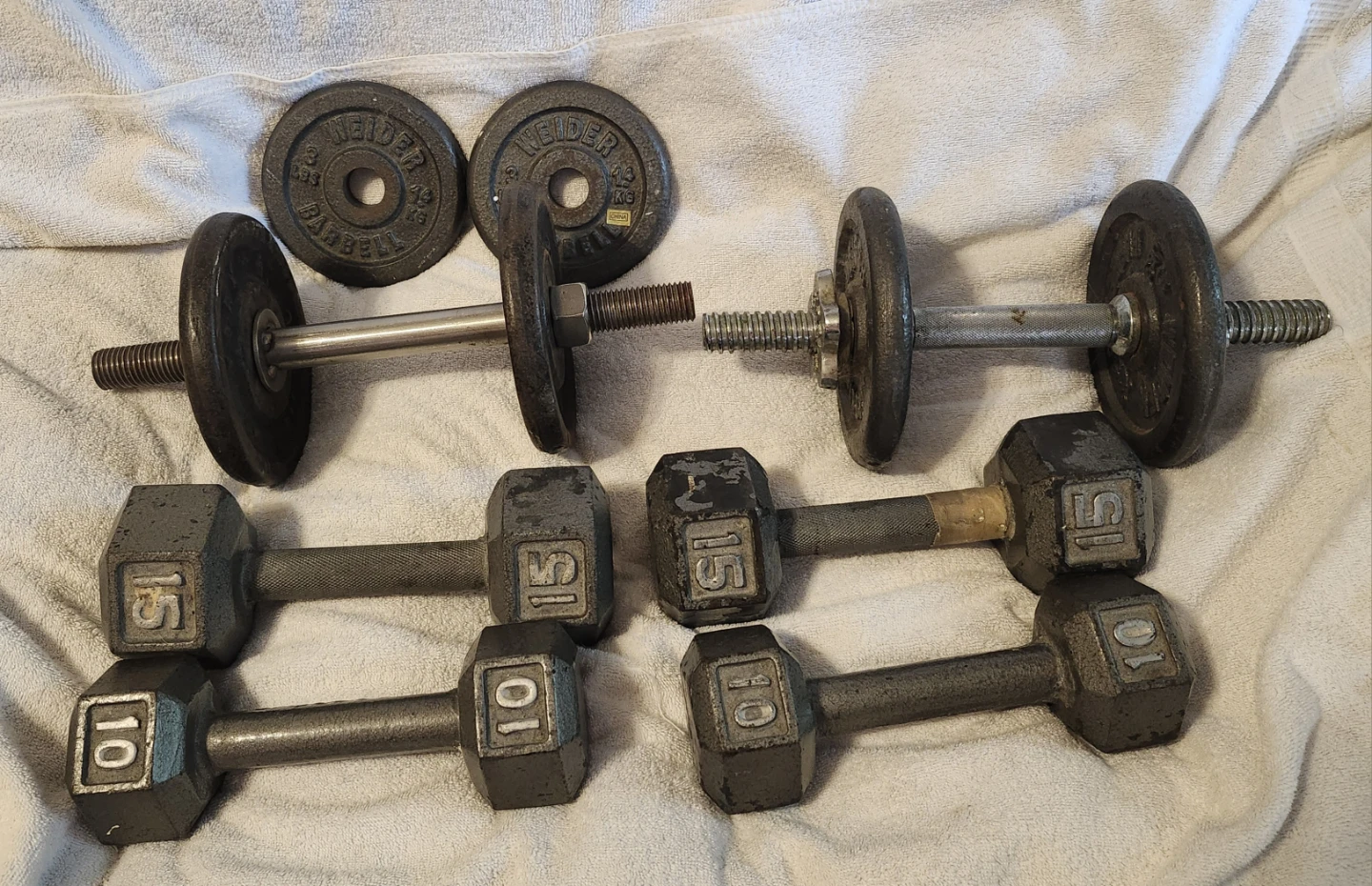 6 Dumbbells weights with 2 extra plates - Pre-owned