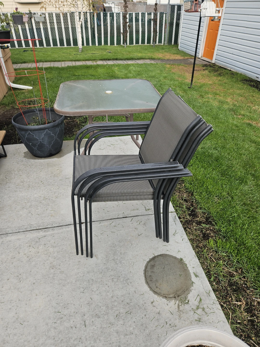 Stackable Patio Chairs and Glass Table Set - photo 2