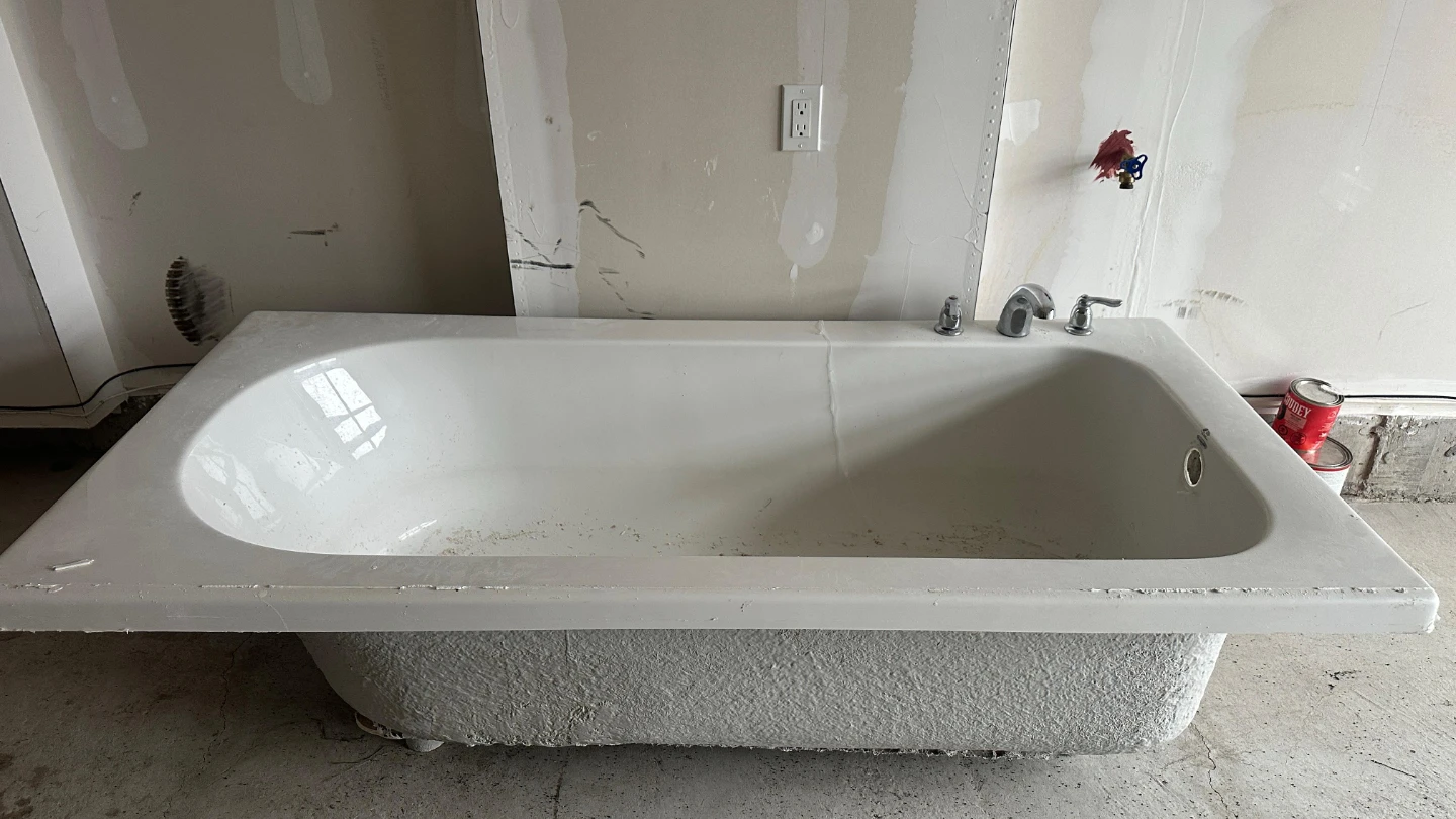 White Bathtub with Faucet Fixture