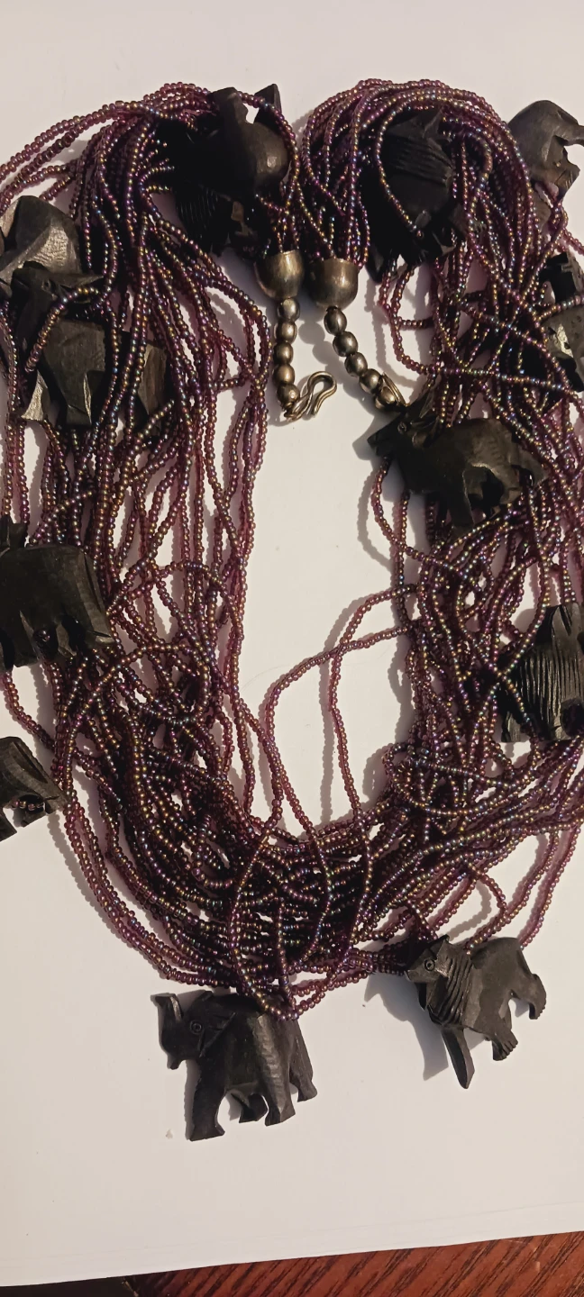Purple Beaded Necklace with Carved Animal Charms