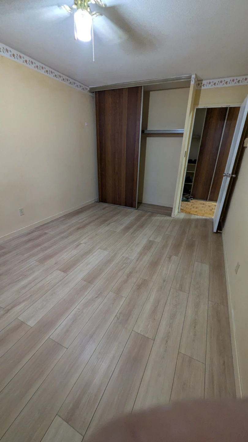 Bedroom with hardwood floors and closet - photo 3