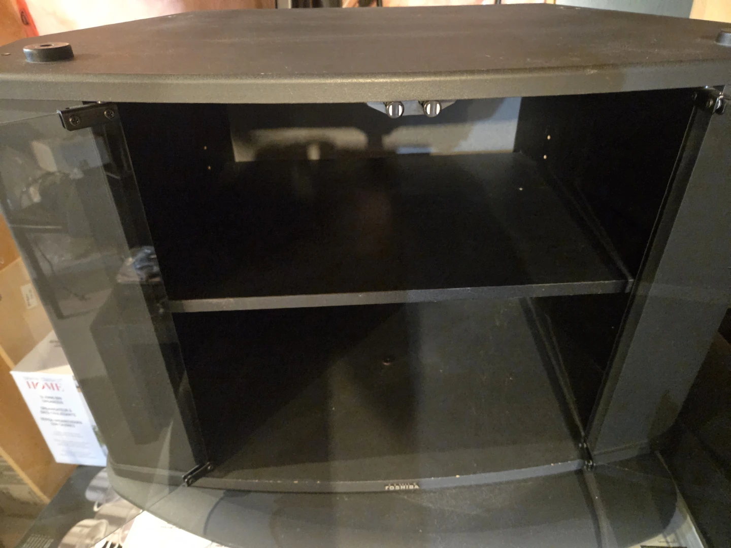 Toshiba TV Stand with Glass Doors and a Swivel Base