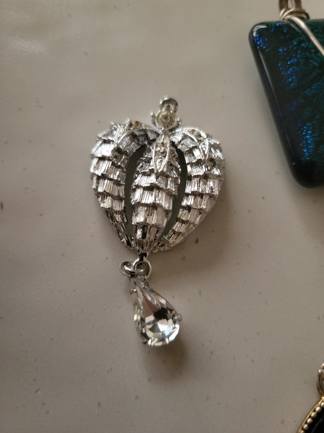 Silver-tone heart pendant with clear teardrop charm