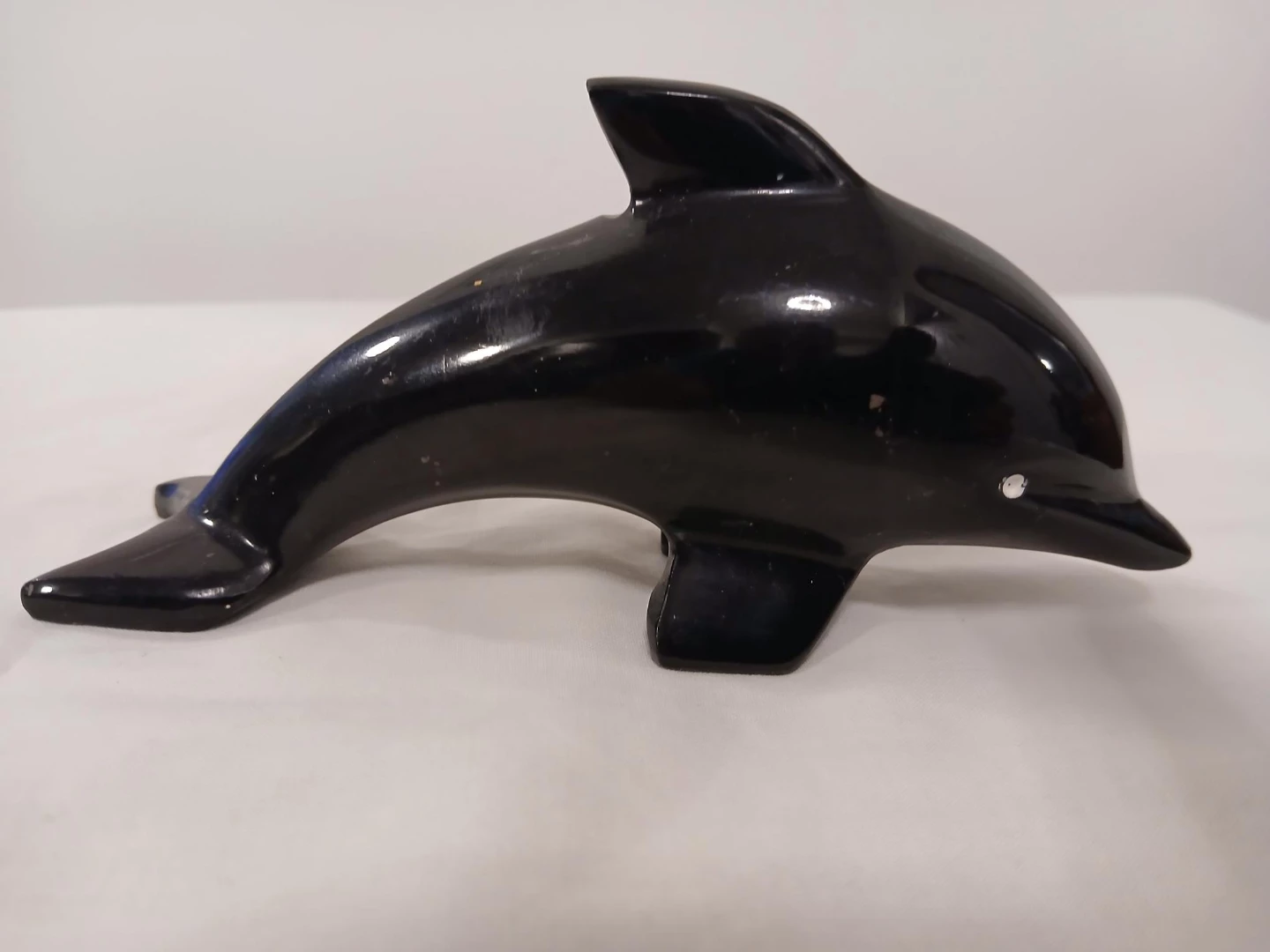 Black Ceramic Dolphin Figurine. Pick up only.