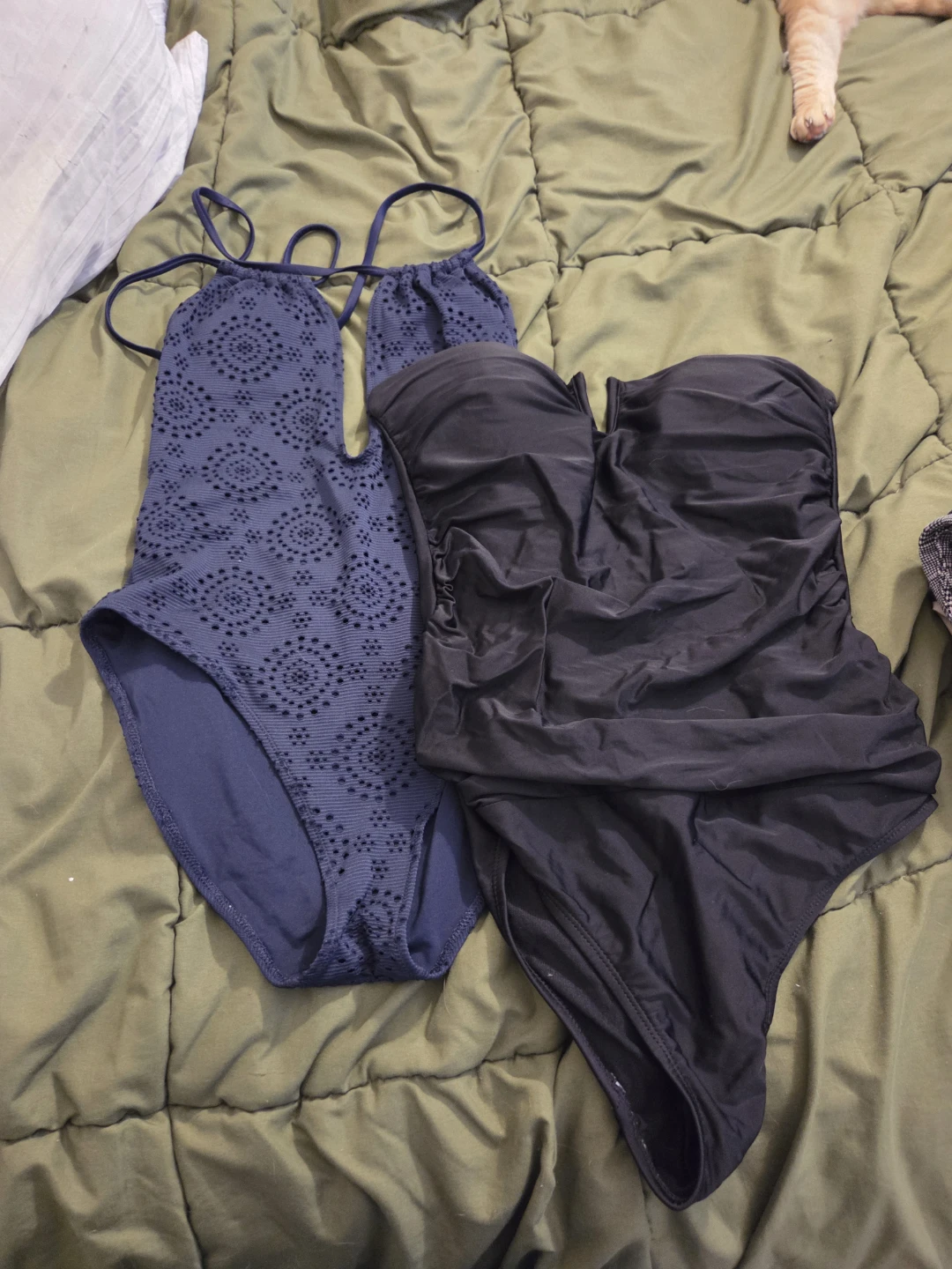 Two swimsuits: blue patterned and black