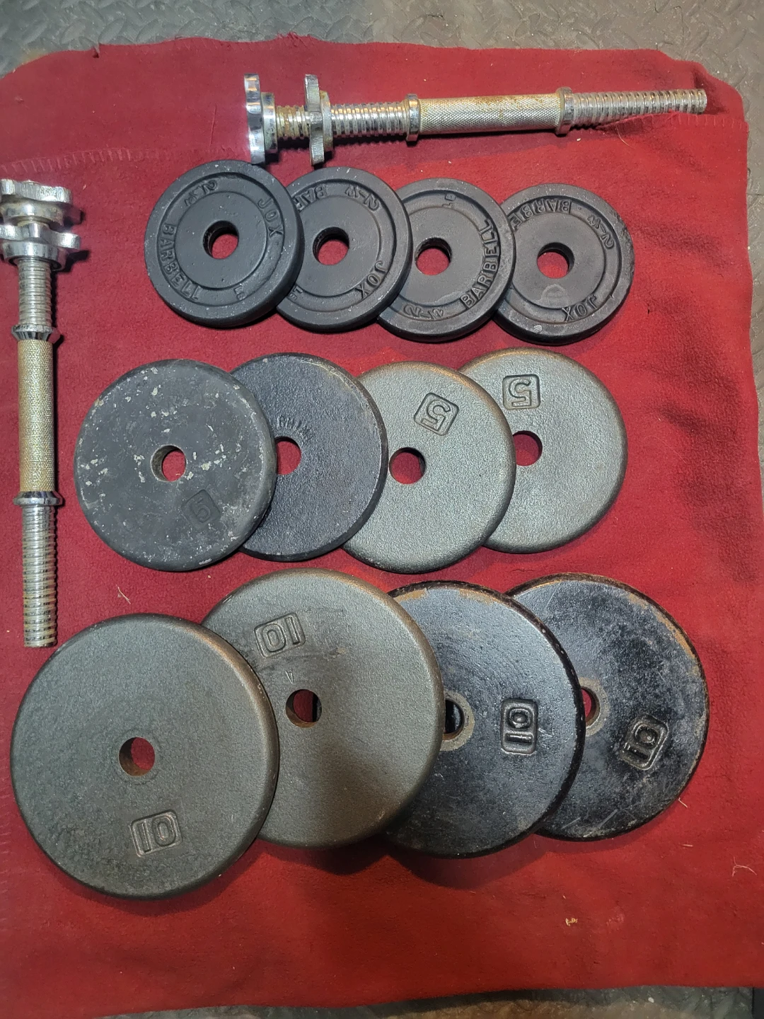 ADJUSTABLE  DUMBBELLS 1" HOLE  70LBs.   4-10s  4-5s. 4-2.5s - photo 2