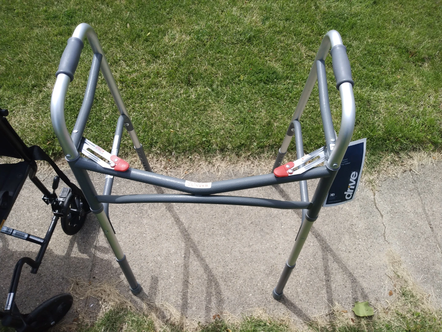 New  Drive Oversized Two Button Folding Walker SE Habla Espanol