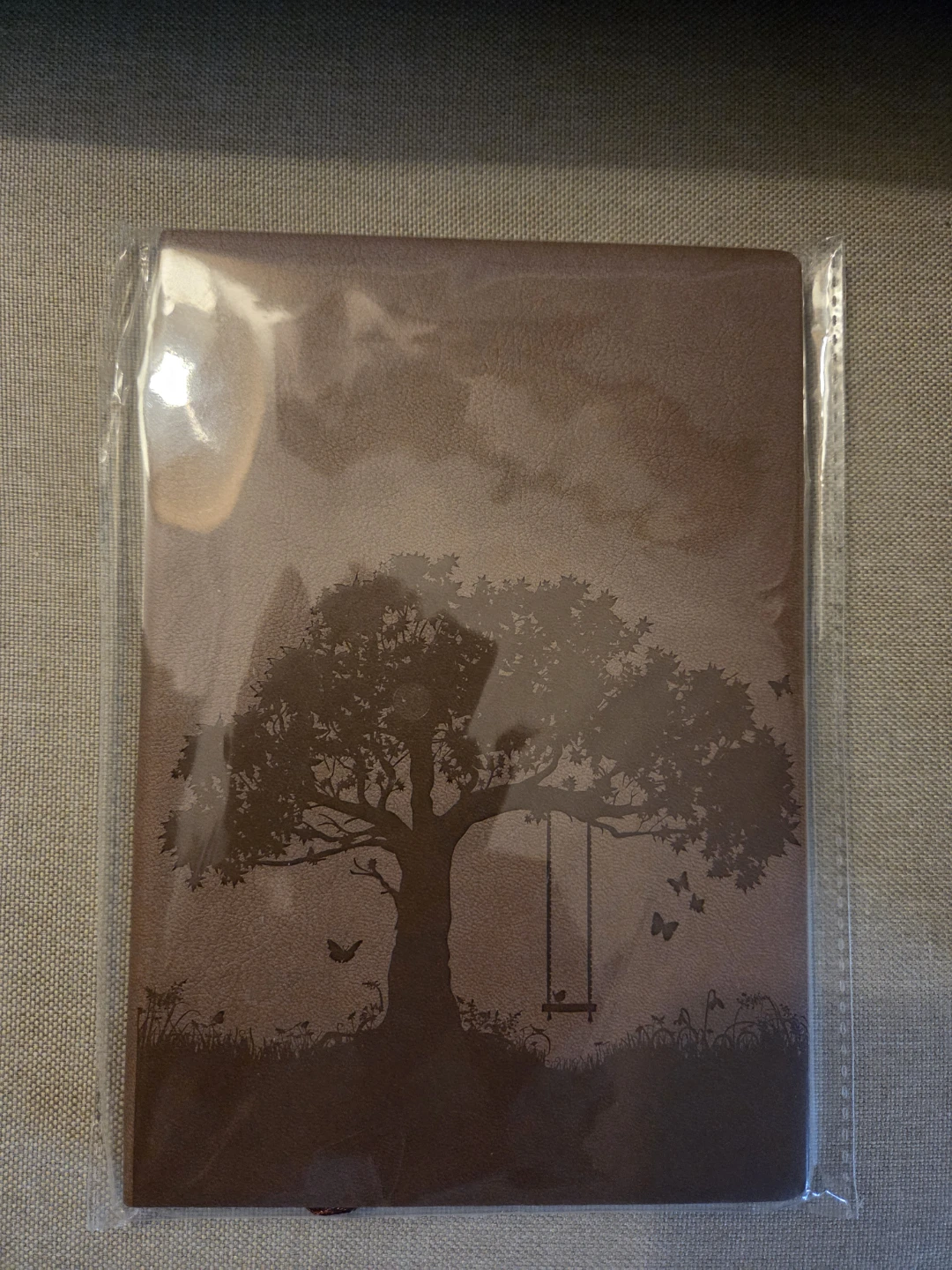 Brown Journal with Tree and Swing Design