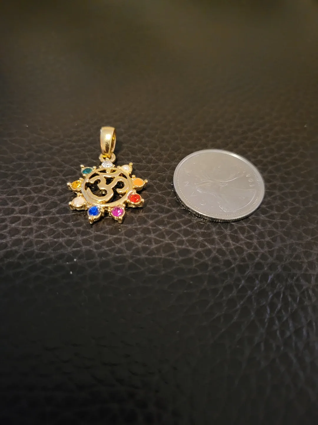 Gold tone Om Pendant with Rainbow Gems