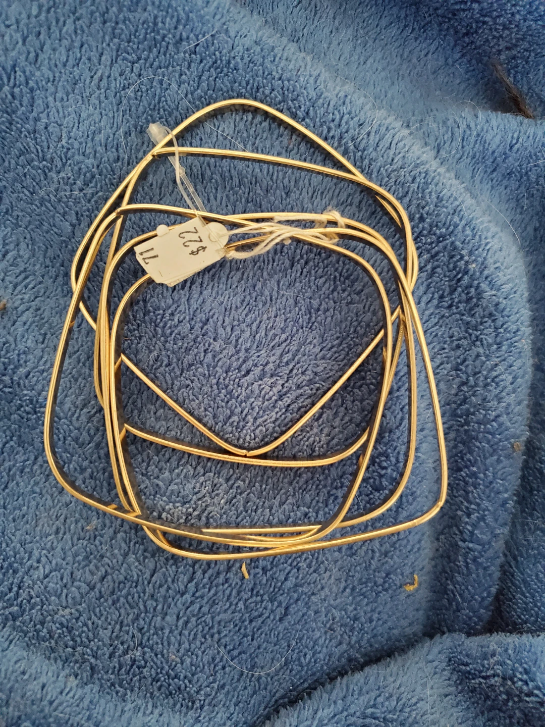 Gold coloured wire shapes