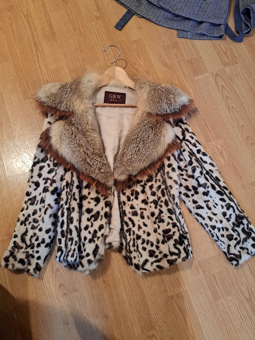 Black faux fur coat with royal blue trim