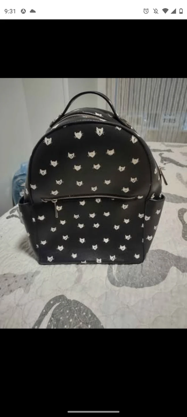 Black backpack with white cat pattern