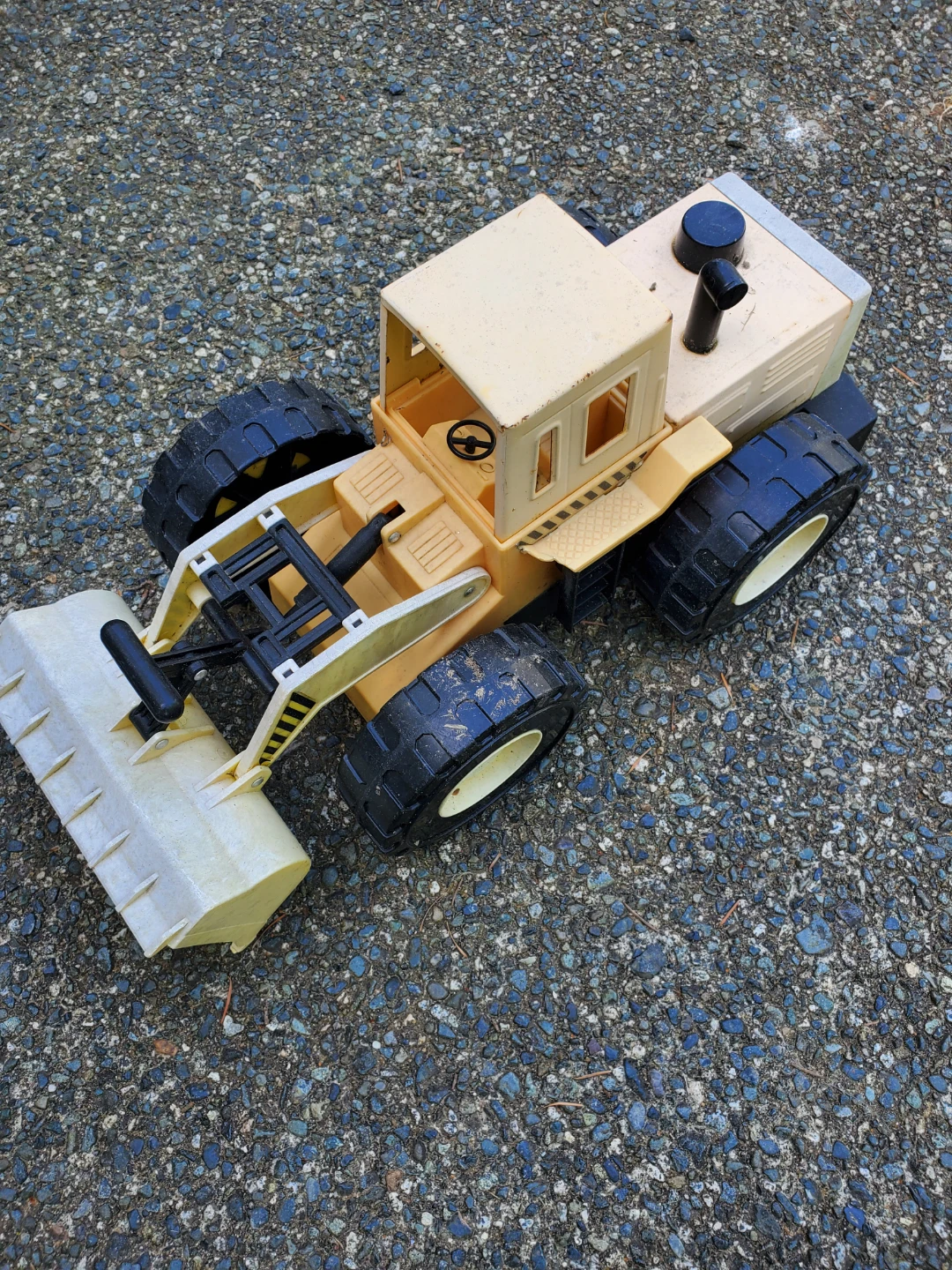 Yellow and Tan Plastic Toy Front Loader Truck