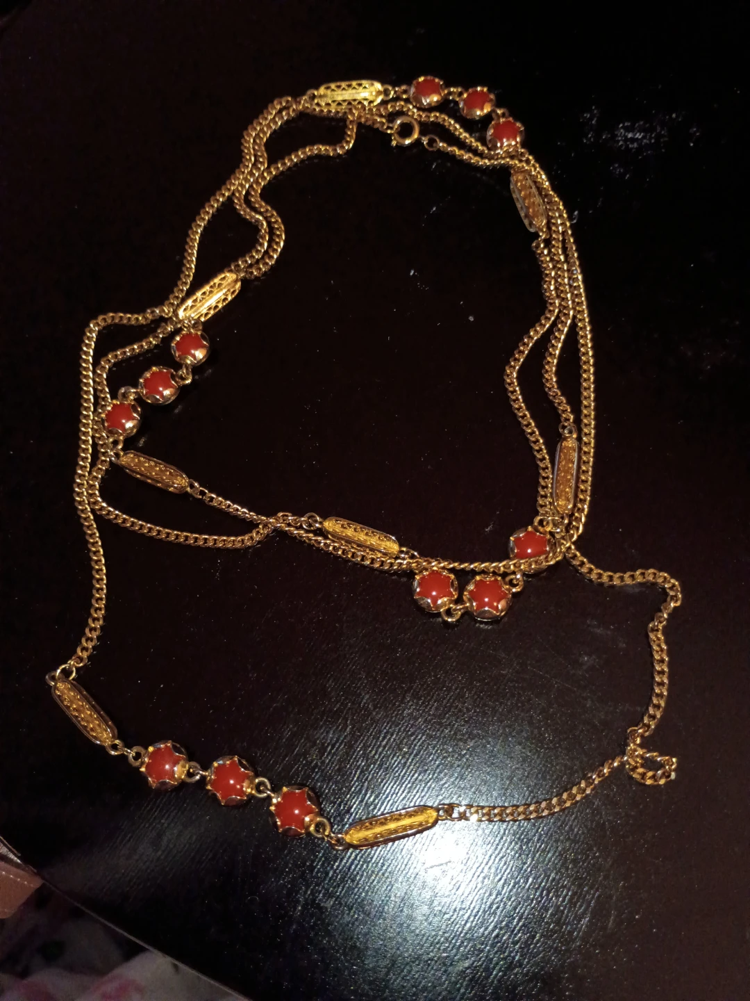 Gold-tone necklace with red beads
