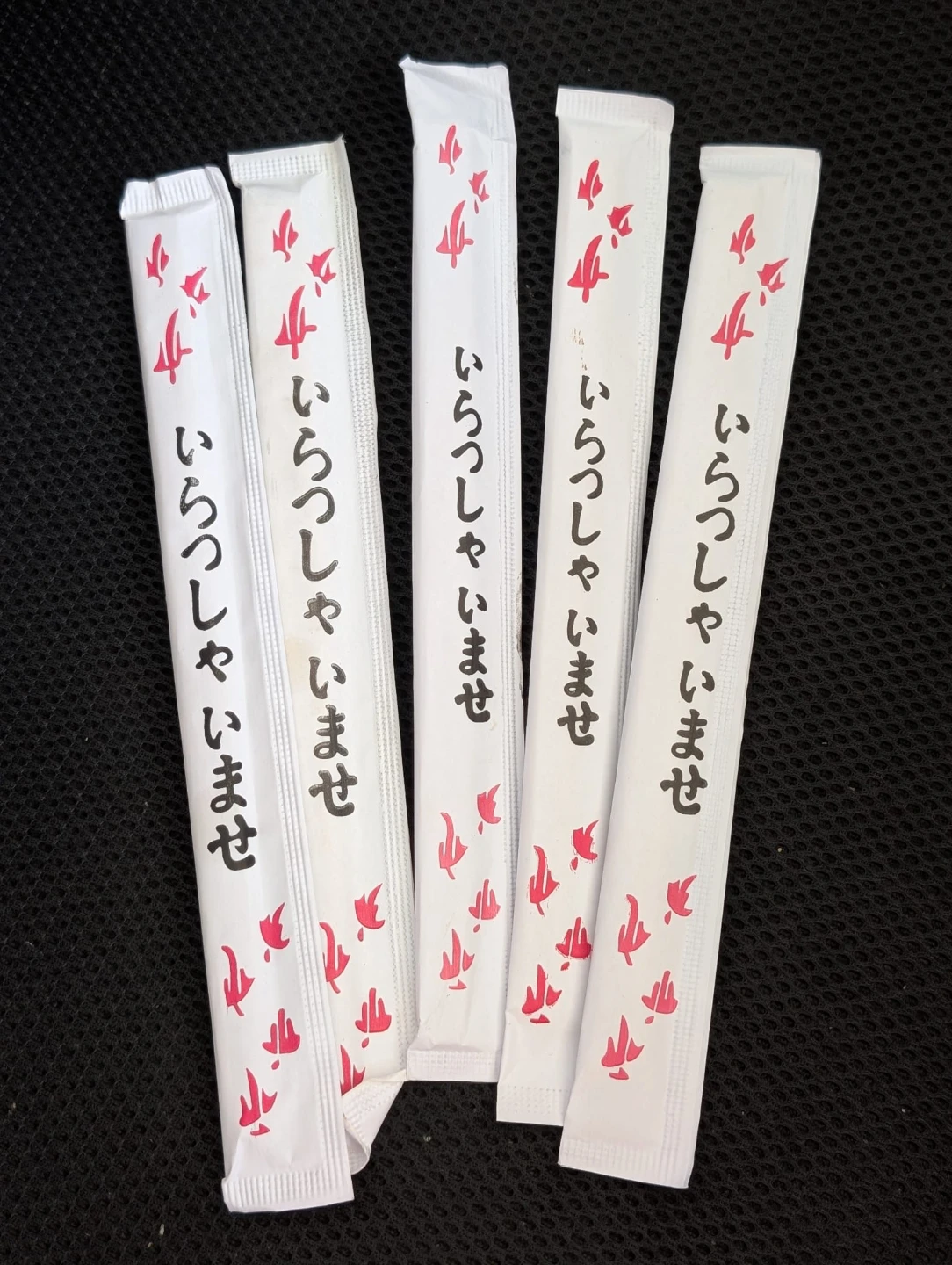 Chopsticks in paper sleeves