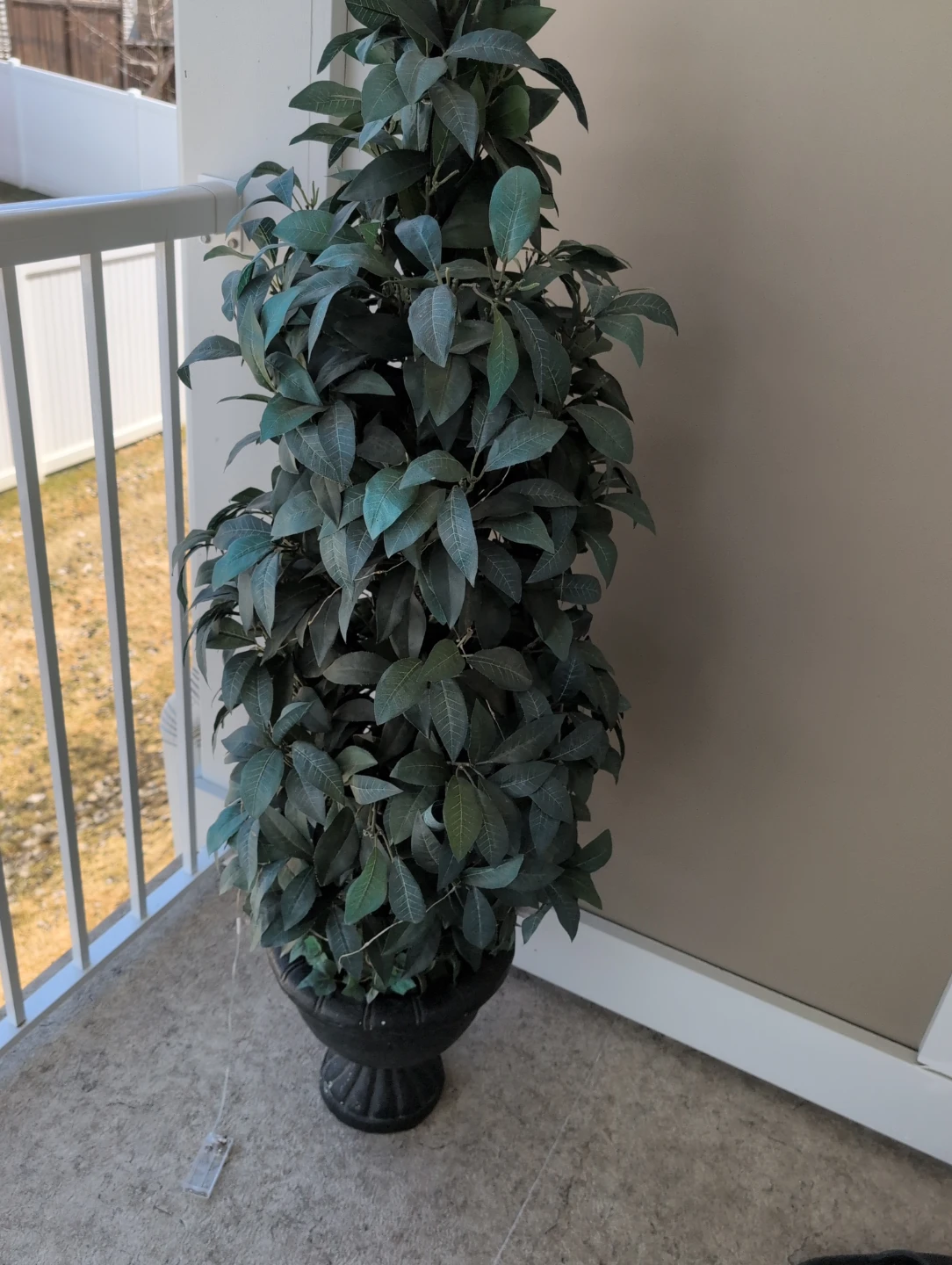 Tall artificial topiary tree