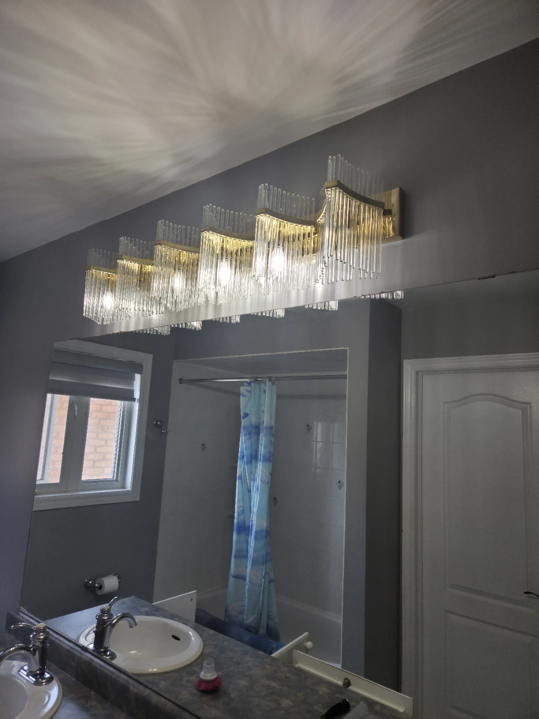 Gold and glass vanity light fixture